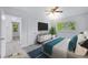 Bright bedroom featuring updated furniture, light-colored walls, and hardwood flooring at 1640 Fairburn Sw Rd, Atlanta, GA 30331