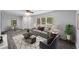 Cozy living room with modern furniture, hardwood floors, and a view into the dining room at 1640 Fairburn Sw Rd, Atlanta, GA 30331