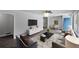 Inviting living room with contemporary decor, hardwood floors, and lots of natural light from large windows at 1640 Fairburn Sw Rd, Atlanta, GA 30331