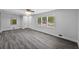 Spacious living room with windows, light walls, hardwood flooring, and recessed lighting at 1640 Fairburn Sw Rd, Atlanta, GA 30331