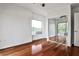 Bright bedroom with hardwood floors, mirrored closet doors, and large windows with outside view at 275 13Th Ne St # 605, Atlanta, GA 30309