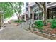 Inviting building entrance with landscaped gardens, stairs, and architectural details at 275 13Th Ne St # 605, Atlanta, GA 30309