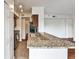 Modern kitchen features granite countertops, stainless steel appliances, and wood cabinets at 275 13Th Ne St # 605, Atlanta, GA 30309