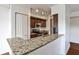 Updated kitchen featuring granite countertops, stainless steel appliances, and stylish cabinetry at 275 13Th Ne St # 605, Atlanta, GA 30309