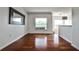 A bright living room with hardwood floors and a view of the neighborhood through large windows at 275 13Th Ne St # 605, Atlanta, GA 30309