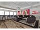 Modern lounge featuring stylish seating, large windows, and a colorful mural offers a vibrant space at 275 13Th Ne St # 605, Atlanta, GA 30309