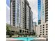 Beautiful swimming pool area with lounge chairs and views of the building's exterior, a great place to relax at 275 13Th Ne St # 605, Atlanta, GA 30309