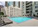 Relaxing pool area with lounge chairs, perfect for enjoying the outdoors and soaking up the sun at 275 13Th Ne St # 605, Atlanta, GA 30309