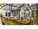 View of deck and rear of home with expansive space for outdoor dining and relaxing at 3030 Heatherstone Dr, Cumming, GA 30041