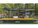 Two-story boat dock featuring metal railings, seating, and ample space for boat storage with lake views at 3030 Heatherstone Dr, Cumming, GA 30041