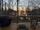 Enjoy lake views from the spacious deck with a stone fire pit, perfect for outdoor gatherings and relaxation at 3030 Heatherstone Dr, Cumming, GA 30041