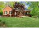 Charming single-story brick home with a well-manicured lawn and mature landscaping in a serene setting at 3030 Heatherstone Dr, Cumming, GA 30041