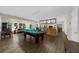Spacious game room complete with a pool table, bar area, and plenty of room for entertainment at 3030 Heatherstone Dr, Cumming, GA 30041