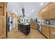 Gourmet kitchen features a large island, stainless steel appliances, granite countertops, and custom cabinets at 3030 Heatherstone Dr, Cumming, GA 30041
