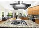 Modern kitchen with a large island, stainless steel appliances, granite countertops, and ample cabinet space at 3030 Heatherstone Dr, Cumming, GA 30041
