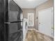 Convenient laundry room featuring new washer and dryer units, and exterior access at 3030 Heatherstone Dr, Cumming, GA 30041