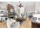 Spacious living room with a stone fireplace, built-in shelves, hardwood floors and plenty of natural light at 3030 Heatherstone Dr, Cumming, GA 30041