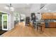 Open living area featuring hardwood floors, seamless transition to the dining area, and bright kitchen at 3030 Heatherstone Dr, Cumming, GA 30041