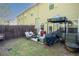 Backyard featuring a small patio area, fenced yard, and home's exterior at 1296 Taylor Way, Stone Mountain, GA 30083