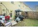 Cozy backyard featuring a patio area, outdoor seating, and partial fence at 1296 Taylor Way, Stone Mountain, GA 30083