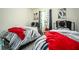 Comfortable bedroom showcasing two twin beds with stylish zebra bedding and red accents at 1296 Taylor Way, Stone Mountain, GA 30083