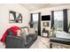 Cozy home office space with comfortable couch, sleek black desk and modern decor at 1296 Taylor Way, Stone Mountain, GA 30083