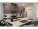 Modern kitchen with stainless steel appliances, granite countertops, and a functional island for cooking and socializing at 1296 Taylor Way, Stone Mountain, GA 30083