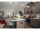 Well-equipped kitchen featuring stainless steel appliances, a spacious island, and stylish barstool seating at 1296 Taylor Way, Stone Mountain, GA 30083