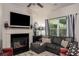 Comfortable living room features an electric fireplace, large TV, and stylish decor for relaxing entertainment at 1296 Taylor Way, Stone Mountain, GA 30083