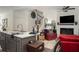 Bright living space with kitchen island, fireplace, and comfortable seating creating an inviting atmosphere at 1296 Taylor Way, Stone Mountain, GA 30083