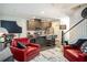 Inviting kitchen and living area with modern appliances, stylish decor, and comfortable seating arrangement at 1296 Taylor Way, Stone Mountain, GA 30083