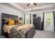 Spacious main bedroom with tray ceiling, neutral carpet, and serene natural light at 1296 Taylor Way, Stone Mountain, GA 30083
