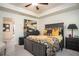 Well-decorated main bedroom with tray ceiling, soft carpet, and serene natural light at 1296 Taylor Way, Stone Mountain, GA 30083