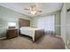 Comfortable bedroom features a ceiling fan, nice furniture, and lots of natural light at 173 Kingswood Dr, Ellenwood, GA 30294