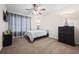 Cozy bedroom featuring a ceiling fan, neutral walls, and ample natural light at 173 Kingswood Dr, Ellenwood, GA 30294