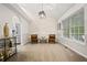 Bright dining area featuring elegant lighting, neutral walls, and refined decor at 173 Kingswood Dr, Ellenwood, GA 30294