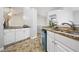 Bright kitchen with white cabinets, granite countertops, and updated appliances at 173 Kingswood Dr, Ellenwood, GA 30294