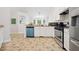 Well-lit kitchen with white cabinets, granite countertops, and stainless steel appliances at 173 Kingswood Dr, Ellenwood, GA 30294