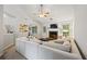 Bright living room featuring a large fireplace, neutral paint, and a comfortable sectional sofa at 173 Kingswood Dr, Ellenwood, GA 30294