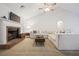 Cozy living room showcasing a brick fireplace, plush sofa, and high ceilings at 173 Kingswood Dr, Ellenwood, GA 30294