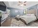 Spacious main bedroom with vaulted ceilings, ceiling fan and decorative appointments at 173 Kingswood Dr, Ellenwood, GA 30294