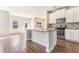 Bright kitchen with granite countertops, stainless steel appliances, tile backsplash, and eat-in area with natural light at 2349 Hanover Woods Rd, Lithonia, GA 30058