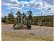 Community playground area with slides, a climbing structure, and a swing set for outdoor fun and recreation at 2349 Hanover Woods Rd, Lithonia, GA 30058