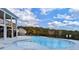 Large outdoor swimming pool with clear water and ample deck space for relaxing and enjoying the sunshine at 2349 Hanover Woods Rd, Lithonia, GA 30058