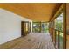 This porch has a wood floor, ceiling and screened views to the backyard at 313 Yancy Se Dr, Marietta, GA 30067