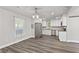 Bright kitchen with stainless steel appliances, white cabinets, and wood floors at 313 Yancy Se Dr, Marietta, GA 30067