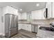 Renovated kitchen with white cabinets, stainless steel appliances, and granite countertops at 313 Yancy Se Dr, Marietta, GA 30067
