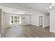 Open-concept living space featuring wood floors, barn doors and stainless steel appliances in the kitchen at 313 Yancy Se Dr, Marietta, GA 30067