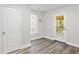 This mud room has a door to the backyard, closet and wood-look flooring at 313 Yancy Se Dr, Marietta, GA 30067