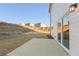 The backyard has a concrete patio with a large, undeveloped grassy area at 5587 Rosehall Pl, Atlanta, GA 30349